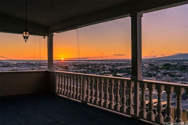 view of balcony at dusk