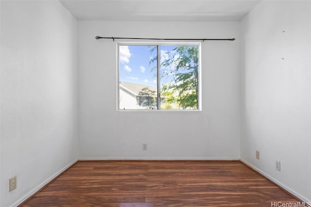 empty room featuring dark hardwood / wood-style floors