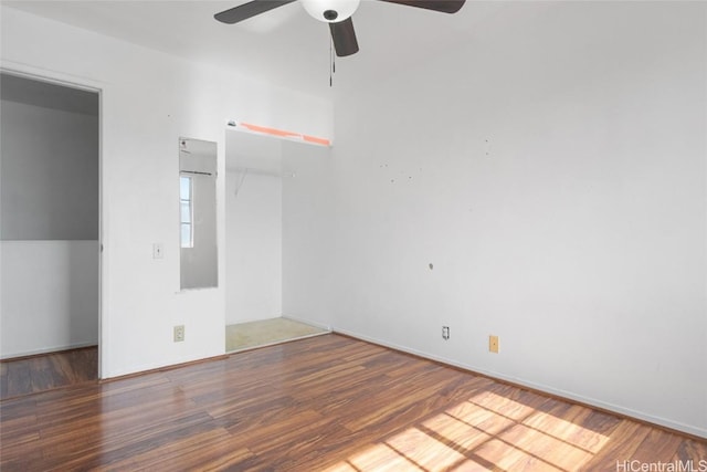 empty room featuring hardwood / wood-style flooring and ceiling fan