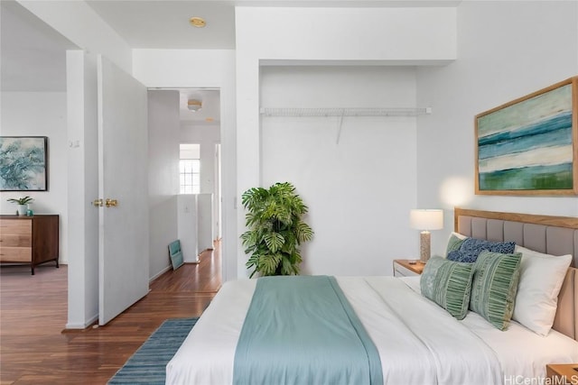 bedroom featuring dark wood-type flooring