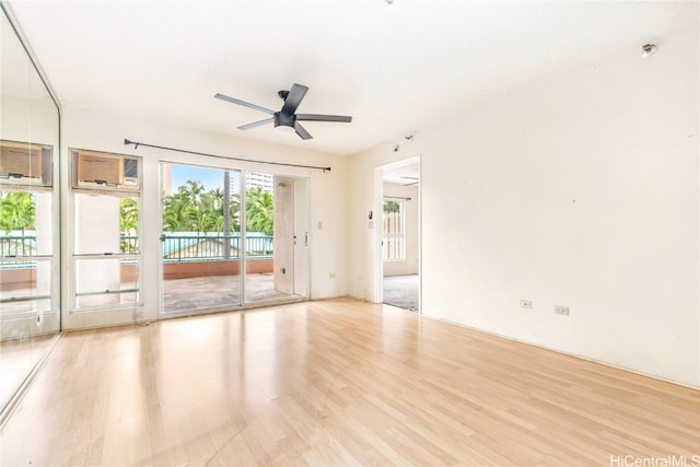 unfurnished room with ceiling fan and light hardwood / wood-style flooring