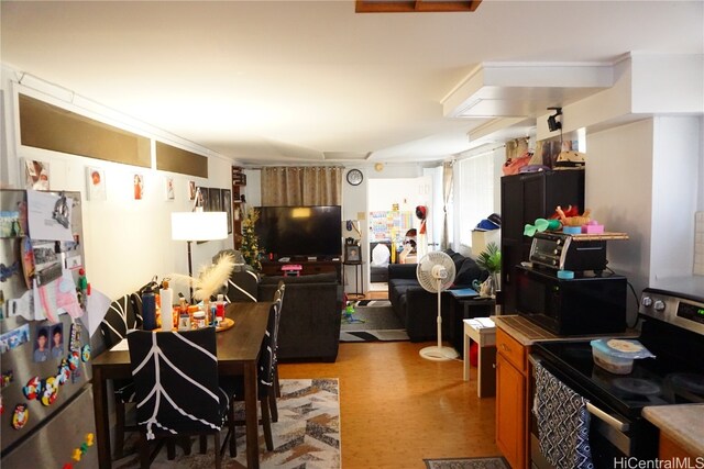 kitchen with appliances with stainless steel finishes and light hardwood / wood-style flooring