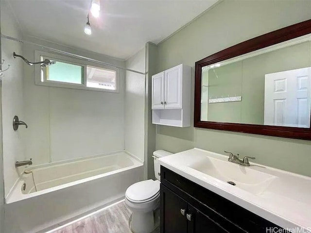 full bathroom with toilet, wood-type flooring, vanity, and bathing tub / shower combination