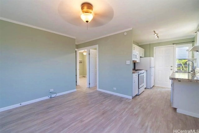 kitchen with white cabinetry, sink, white appliances, and light wood-type flooring