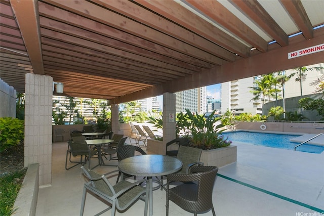 1848 Kahakai Dr Unit 1904, Honolulu, HI 96814 - view of patio with a community pool and outdoor dining area