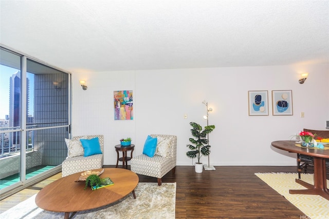 1848 Kahakai Dr Unit 1904, Honolulu, HI 96814 - sitting room featuring wood finished floors and a wall of windows