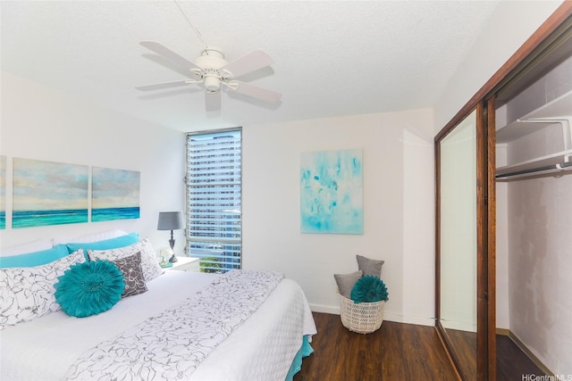 1848 Kahakai Dr Unit 1904, Honolulu, HI 96814 - bedroom featuring wood finished floors, ceiling fan, a textured ceiling, and a closet
