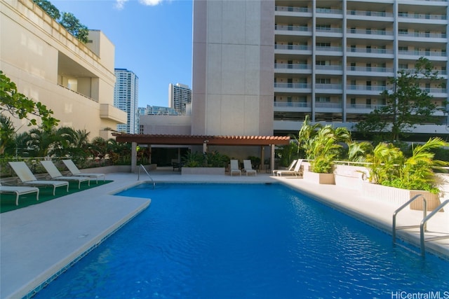 view of pool with a patio area and a pergola