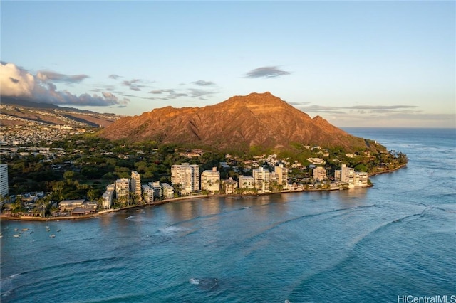 view of water feature with a mountain view and a view of city