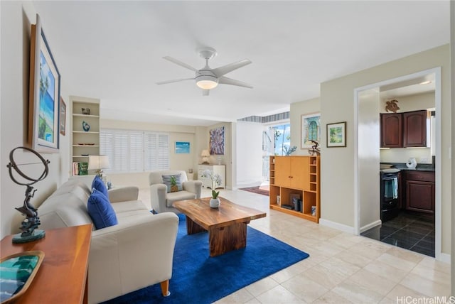 living room featuring light tile patterned floors and ceiling fan