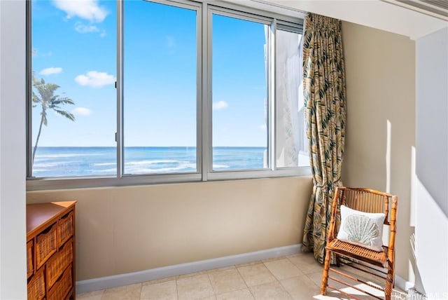 living area featuring a beach view and a water view