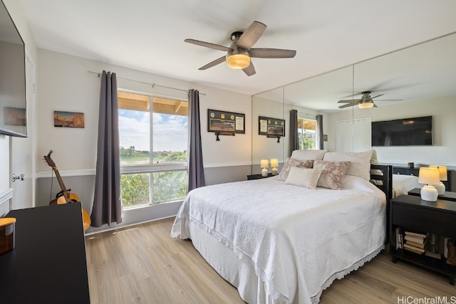 bedroom featuring wood finished floors and a ceiling fan