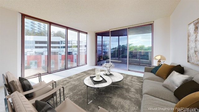 living room with a textured ceiling and floor to ceiling windows