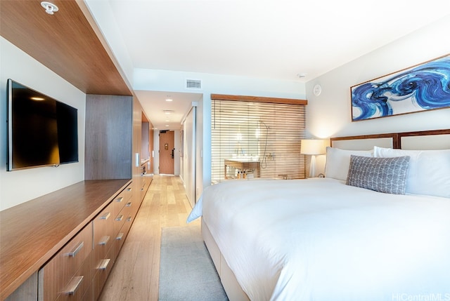 bedroom with light hardwood / wood-style flooring