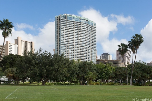 view of property's community with a lawn