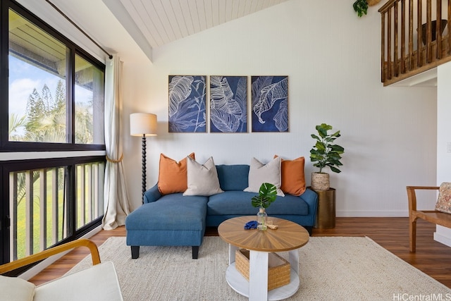 living area featuring wooden ceiling, hardwood / wood-style flooring, and lofted ceiling