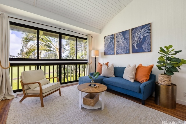 sunroom featuring wooden ceiling, a healthy amount of sunlight, and vaulted ceiling