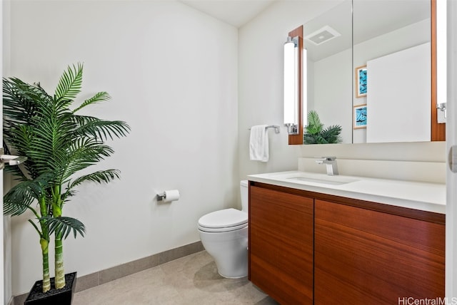 bathroom with tile patterned floors, vanity, and toilet