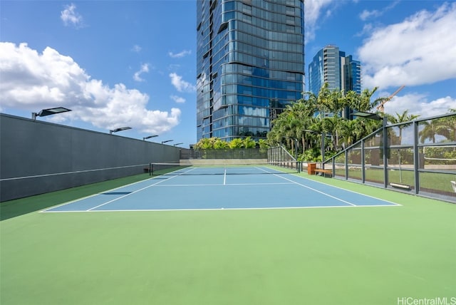 view of tennis court featuring basketball court