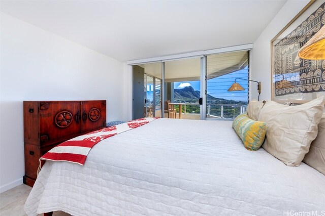 bedroom with access to exterior and light colored carpet