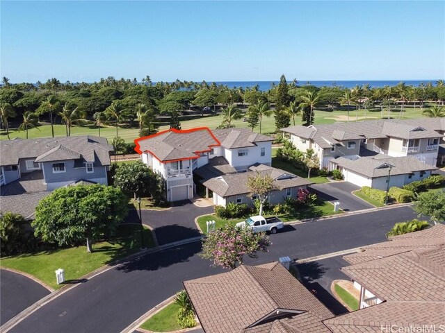 bird's eye view with a residential view and a water view