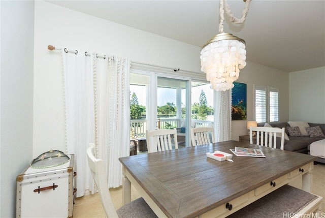 dining space featuring a notable chandelier