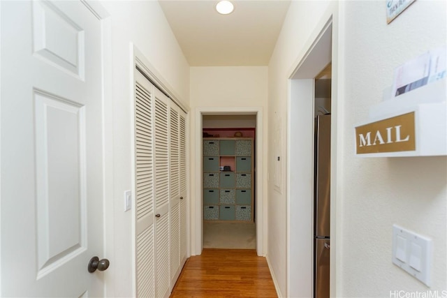 corridor with wood finished floors