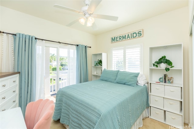 bedroom featuring access to exterior, multiple windows, and ceiling fan