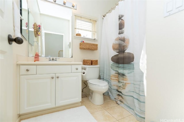 bathroom with vanity, tile patterned floors, toilet, and a shower with curtain