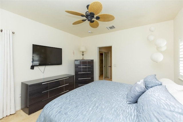 bedroom with light carpet, visible vents, and a ceiling fan