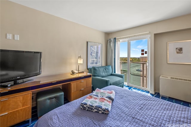 bedroom featuring access to exterior and radiator