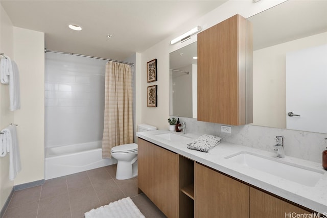 full bathroom with tile patterned flooring, shower / bath combo, toilet, and vanity