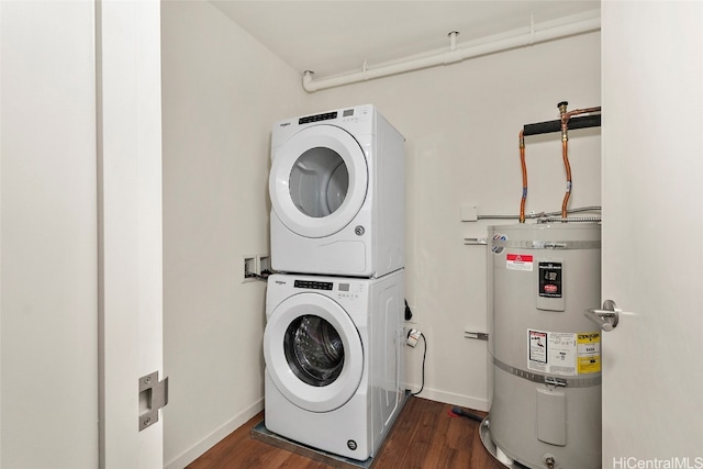 washroom featuring secured water heater, stacked washer and dryer, and dark wood-type flooring