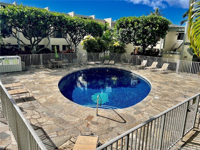 view of pool featuring a patio