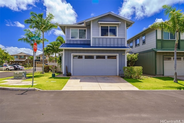 view of front of property with a front yard and a garage