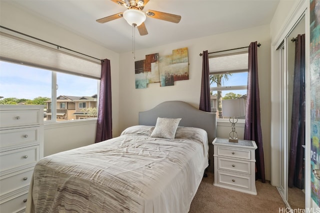 carpeted bedroom featuring ceiling fan