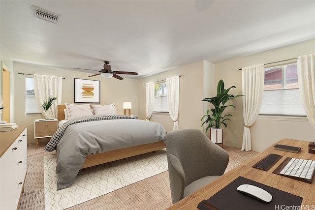 carpeted bedroom with ceiling fan