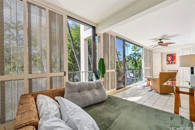 sunroom featuring ceiling fan