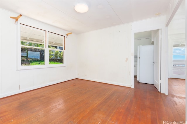 empty room with dark wood-type flooring