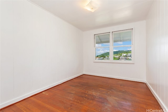 spare room with hardwood / wood-style flooring