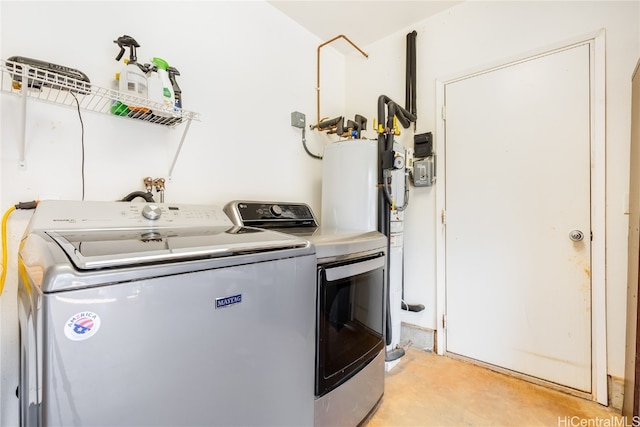 clothes washing area with separate washer and dryer