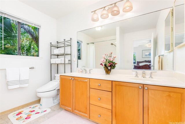 95-1044 Meapa St, Mililani, HI 96789 - ensuite bathroom with double vanity, toilet, tile patterned flooring, a shower with curtain, and baseboards