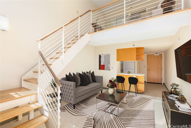 living room featuring a high ceiling