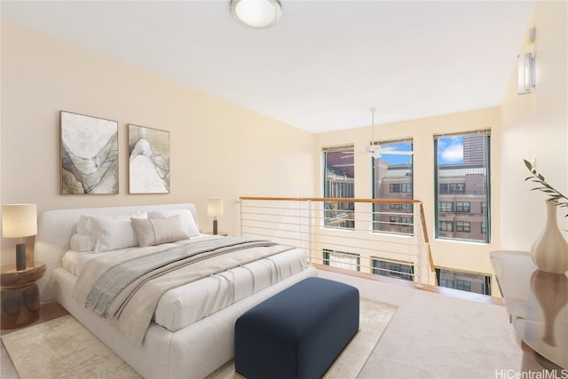 bedroom featuring light carpet