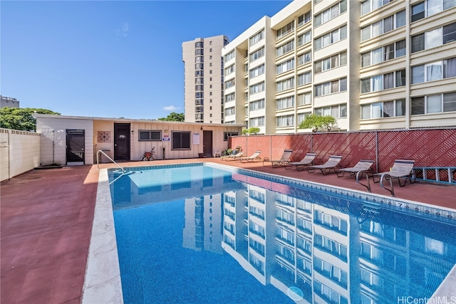 view of swimming pool with a patio area