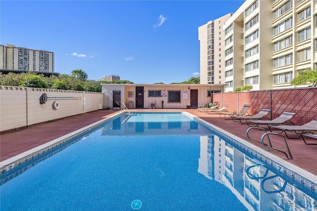 5122 Likini St Unit 302, Honolulu, HI 96818 - community pool with a patio area