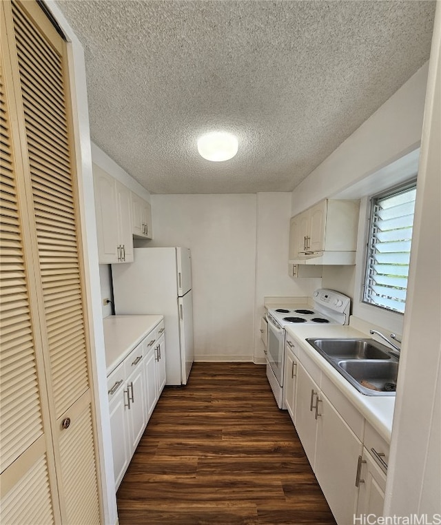 kitchen with dark hardwood / wood-style flooring, white appliances, a textured ceiling, sink, and white cabinets