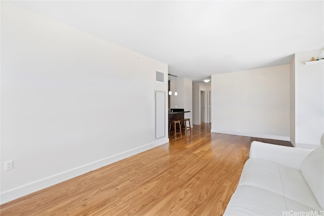 unfurnished living room with hardwood / wood-style floors