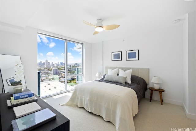 bedroom featuring ceiling fan and light carpet