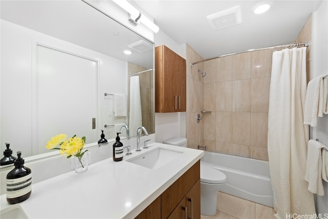 full bathroom with toilet, vanity, tile patterned floors, and shower / bath combo with shower curtain